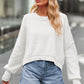 White oversized round neck drop shoulder sweater with ribbed cuffs
