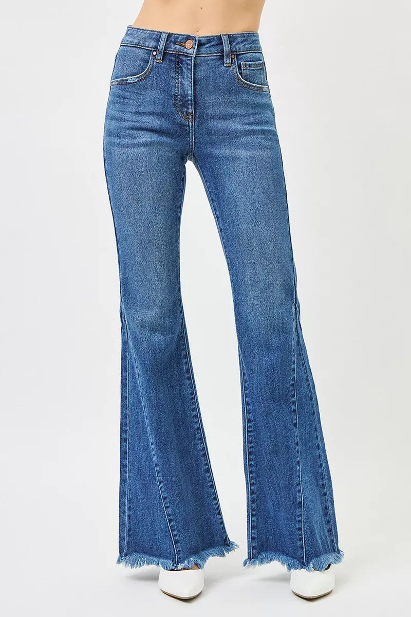 RISEN mid rise flare jeans in blue denim with frayed hem