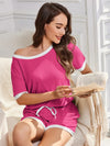 Pink and white off-the-shoulder ribbed pajama set by Daverri Fashions