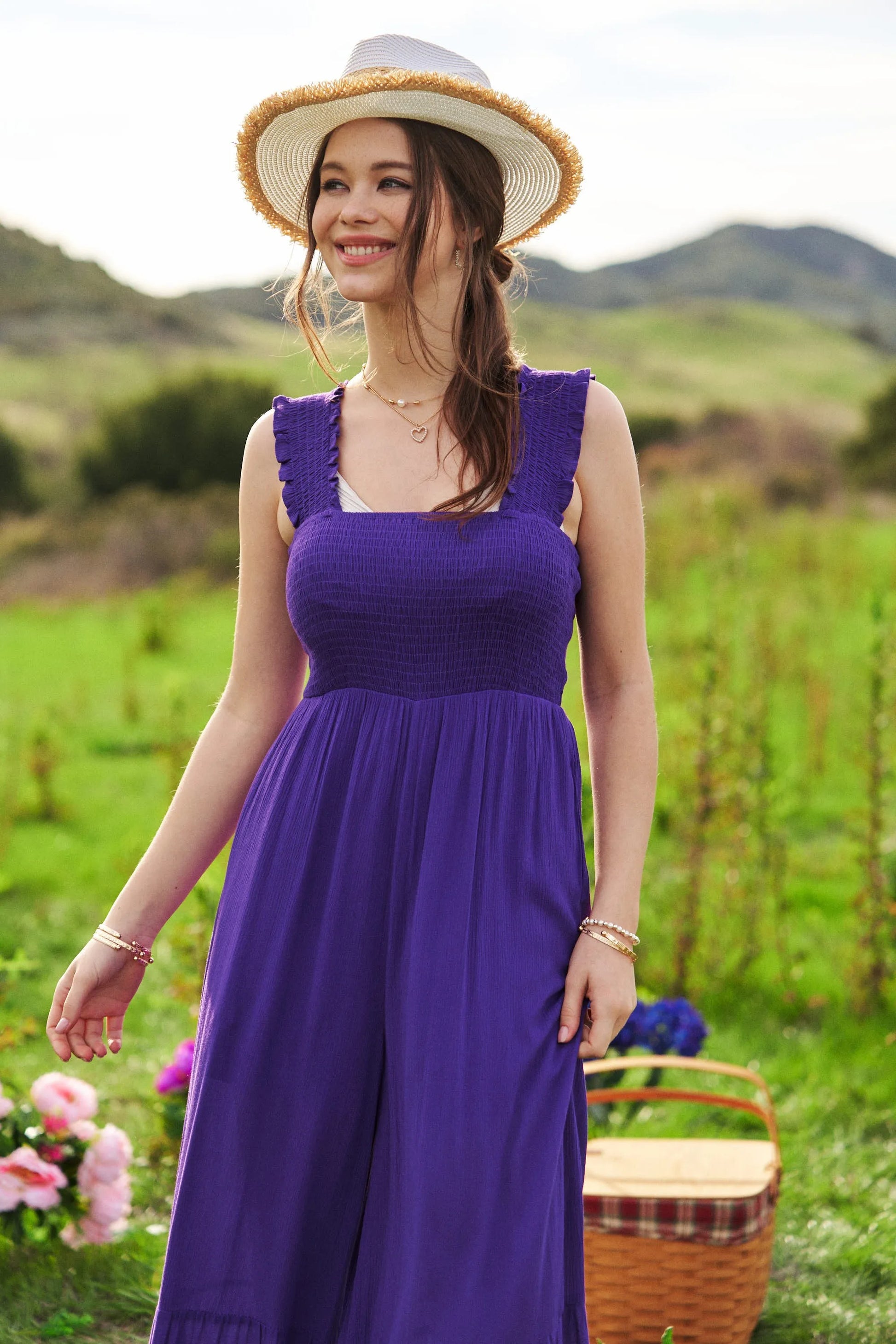 Vibrant purple Davi & Dani smocked bodice ruffle strap jumpsuit