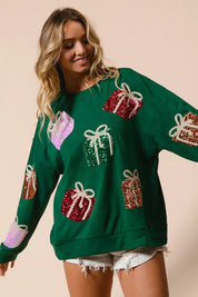 Green sequined gift box sweater with pastel accents and lace hem