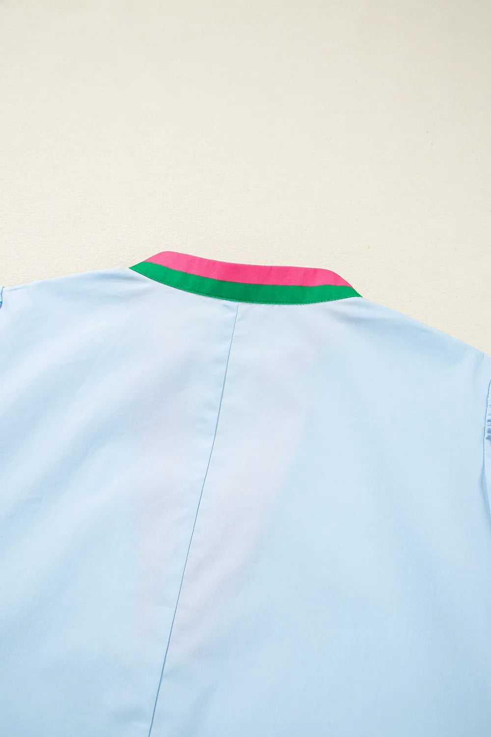 Light blue cotton shirt with pink and green striped collar on Notched Puff Sleeve Swing Dress