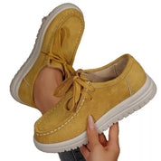 Mustard suede lace-up round toe loafers with white rubber soles