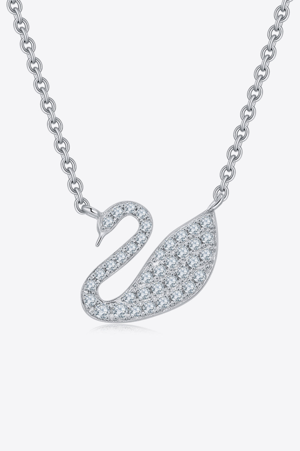 Silver swan pendant necklace on a white background