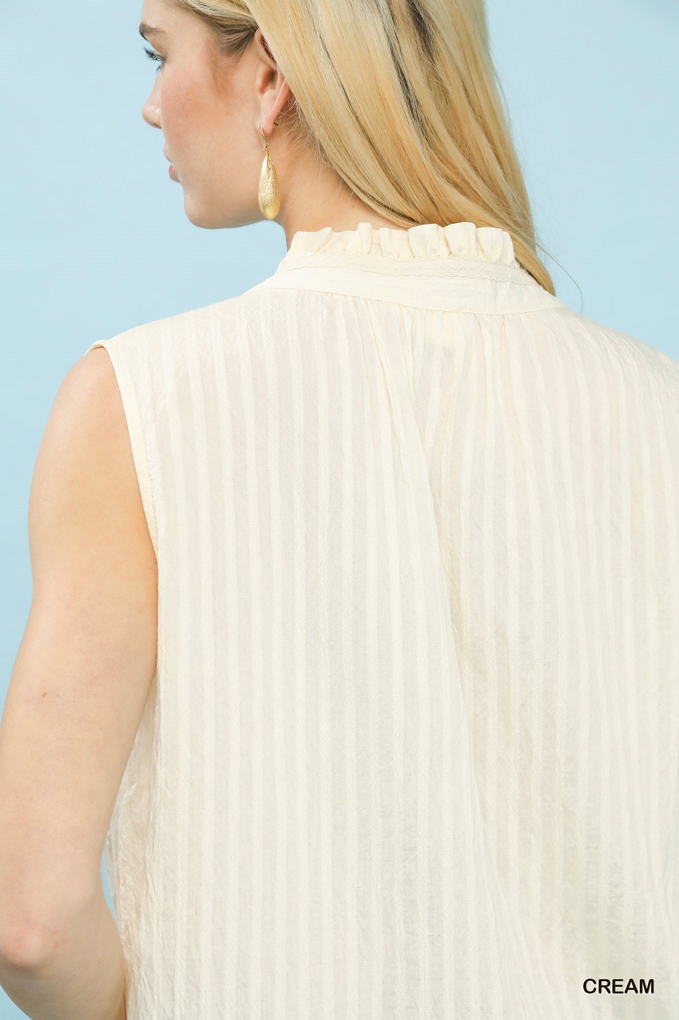 Umgee sleeveless textured split neck top in cream with pleats and ruffle neck