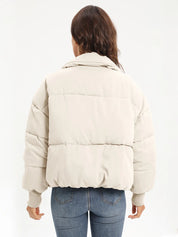 Cream zip-up turtleneck long sleeve puffer jacket with hood and quilted design