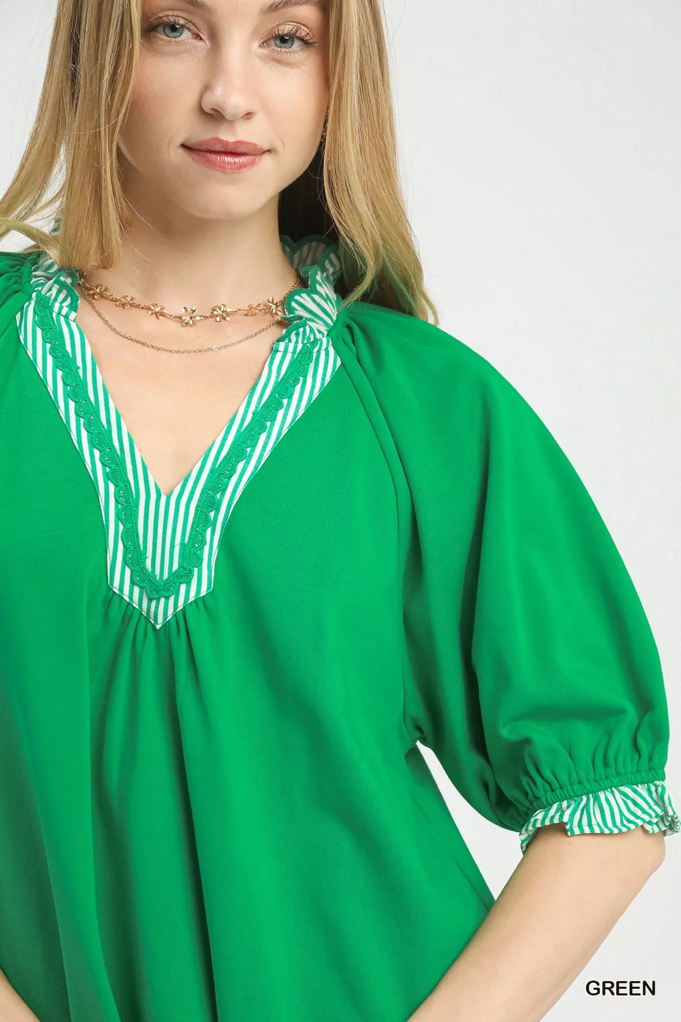 Vibrant green Umgee French Terry top with V-neck lace trim and puffed sleeves