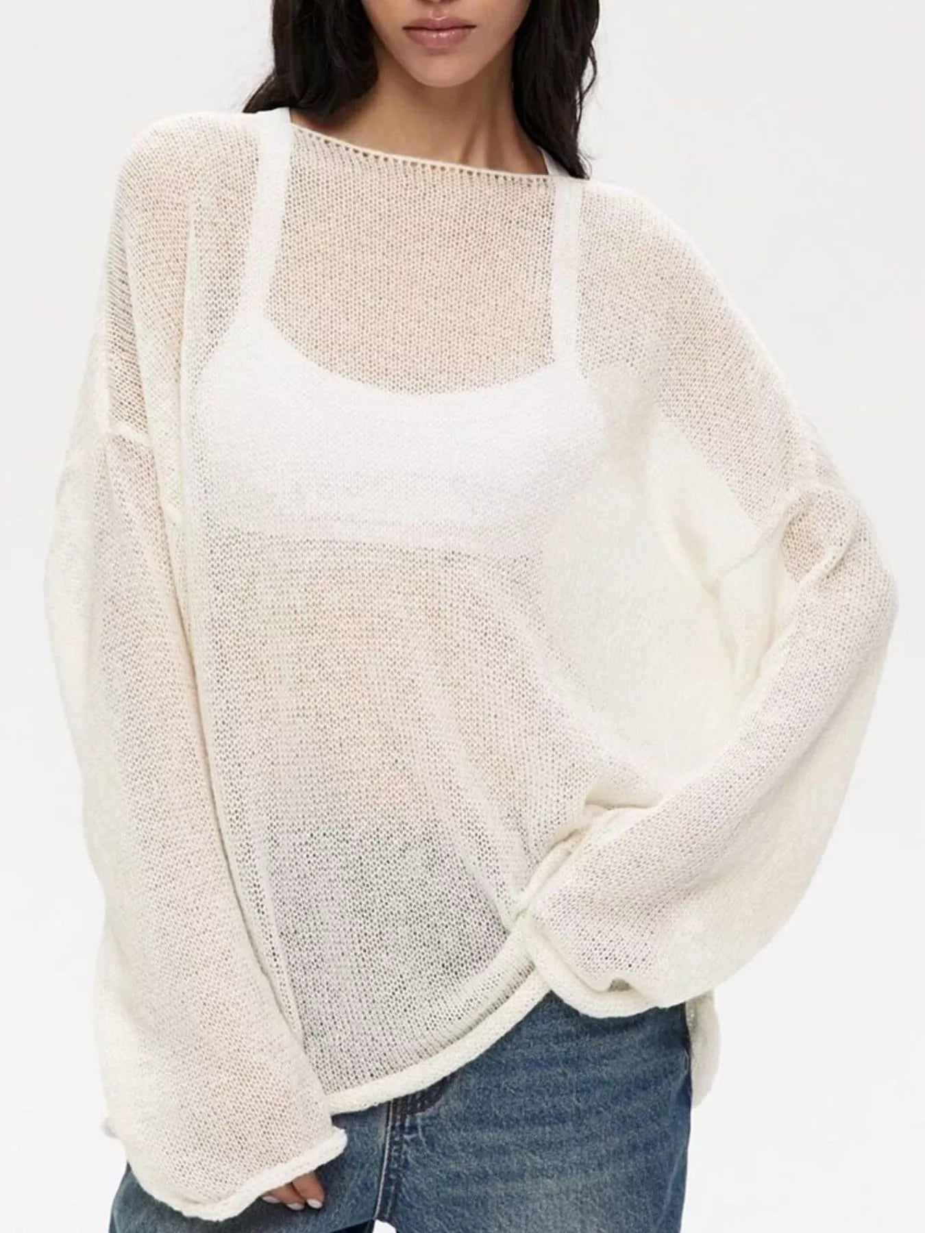 Boat neck dropped shoulder sweater in loose off-white knit with airy sheer texture and wide sleeves