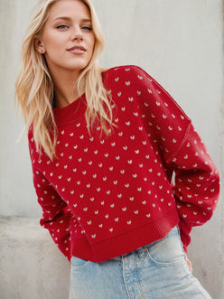 Daverri red knit sweater with white butterfly pattern and ribbed cuffs