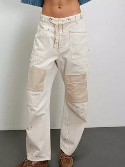 Daverri Washed Relaxed Fit Barrel Jeans in off-white denim with beige patchwork and paint splatters