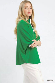 Green ribbed knit top with drawstring collar, bell sleeves and striped trim