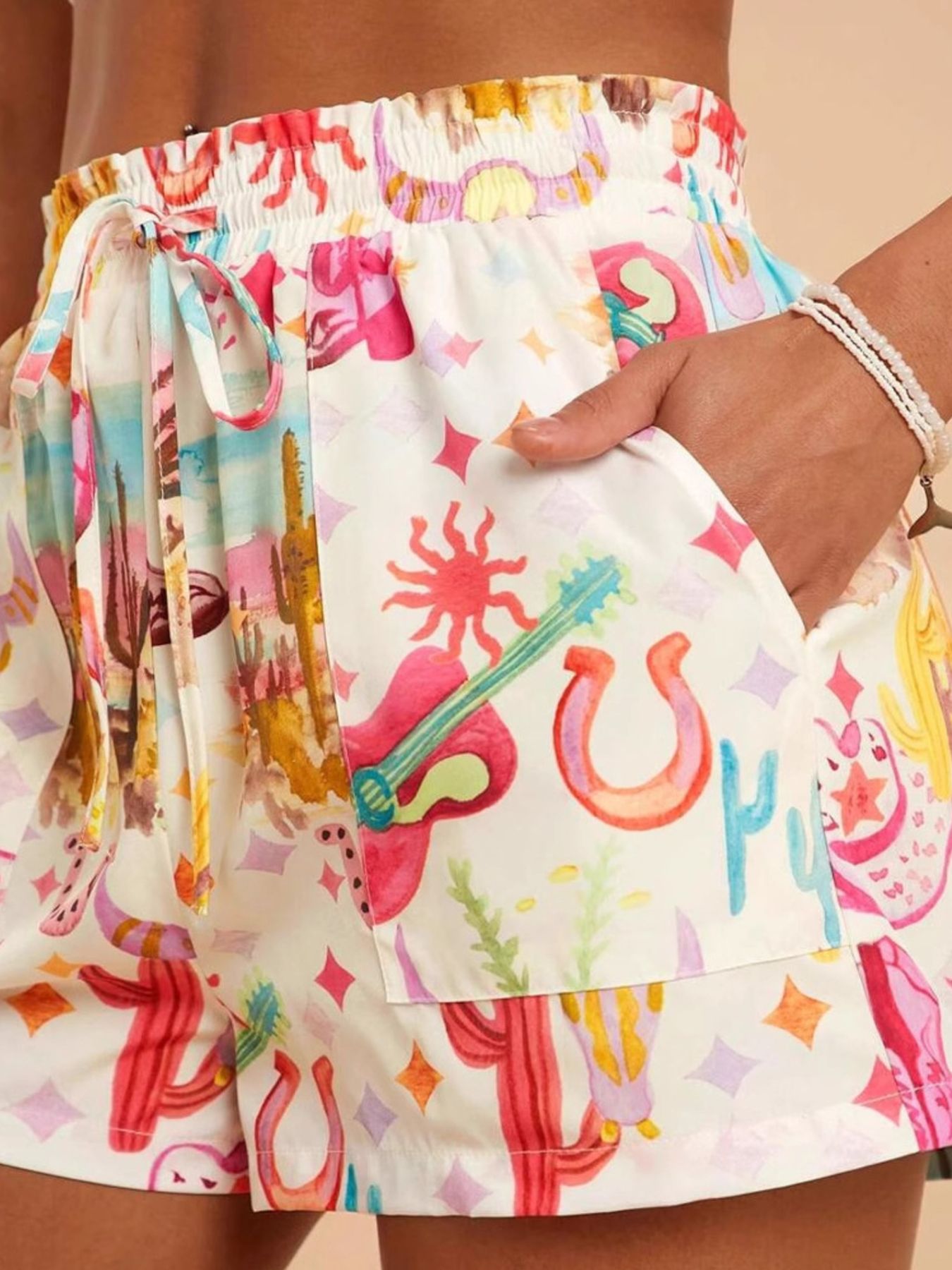 Drawstring printed shorts in white with vibrant watercolor cacti print