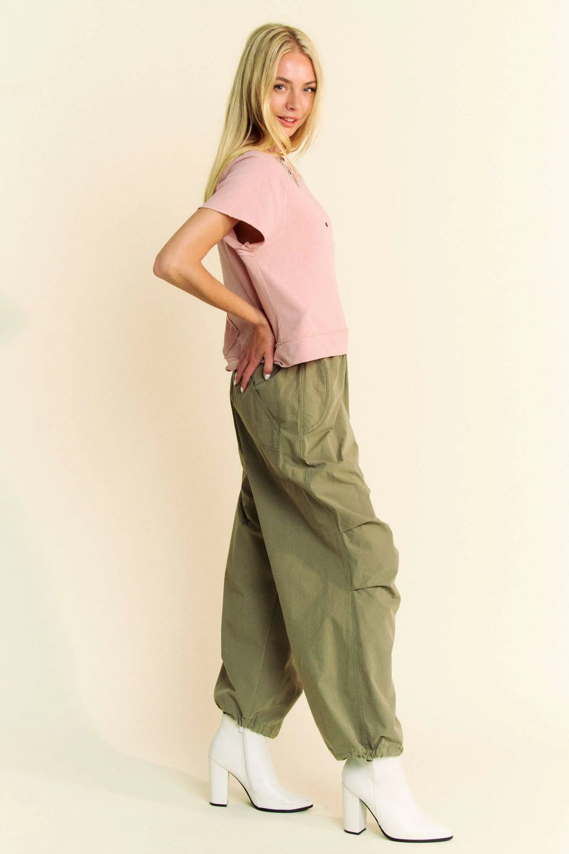 Olive green cargo pants with elastic cuffs and side pockets, paired with Davi & Dani Breezy Knit T-shirt