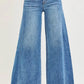 Medium-wash blue Risen high-rise ankle wide-leg jeans with frayed hem