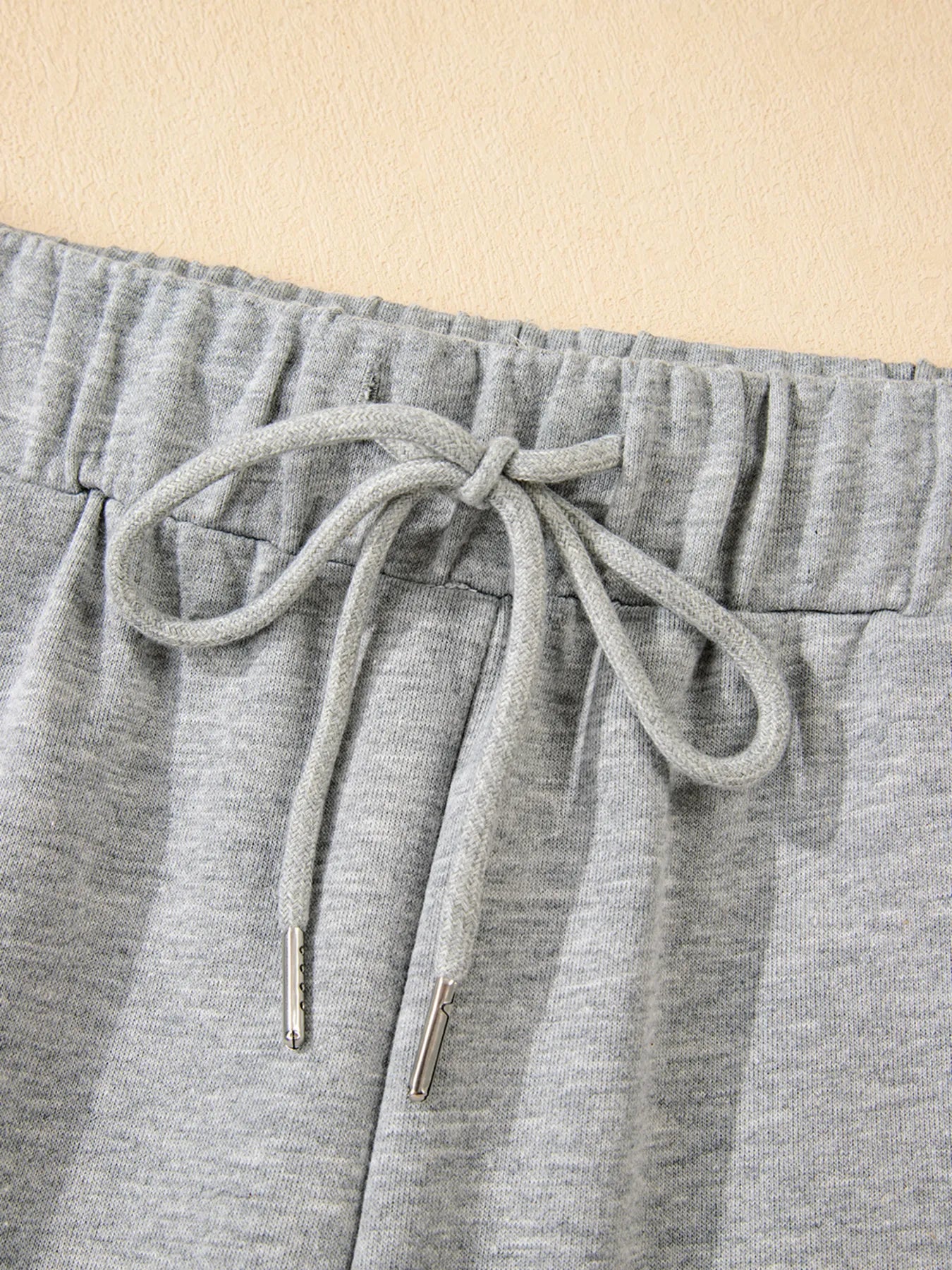 Heather gray drawstring pants in Daverri Fashions set