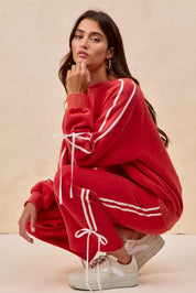 Red velour BiBi Side Lined Bow Details Fleece Sweatpants with white stripes