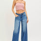 Pink ribbed strapless crop top with frayed hemline and RISEN slouchy baggy jeans
