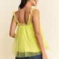 Vibrant lime green sheer ruffled Davi & Dani babydoll top with backless design