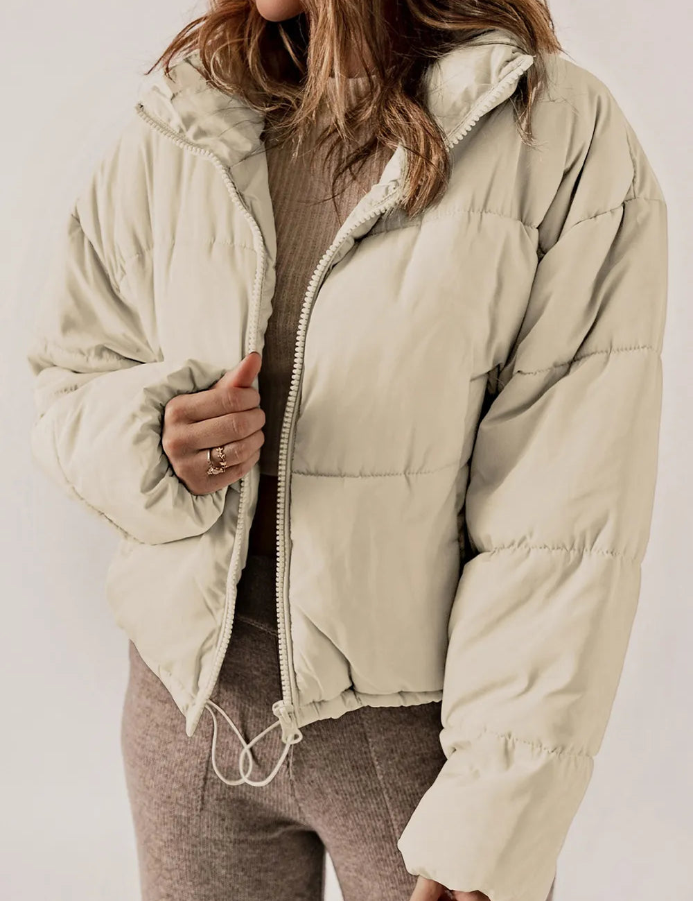Beige zip-up collared puffer jacket with hood for winter warmth