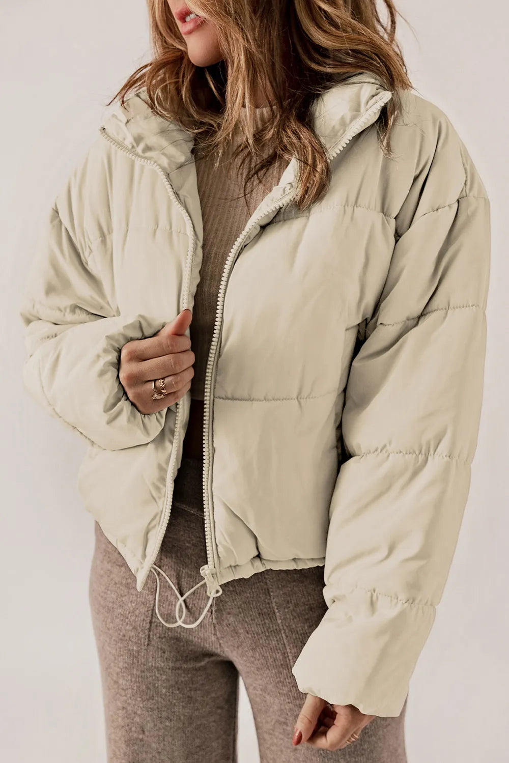 Beige zip-up collared puffer jacket with hood for winter warmth