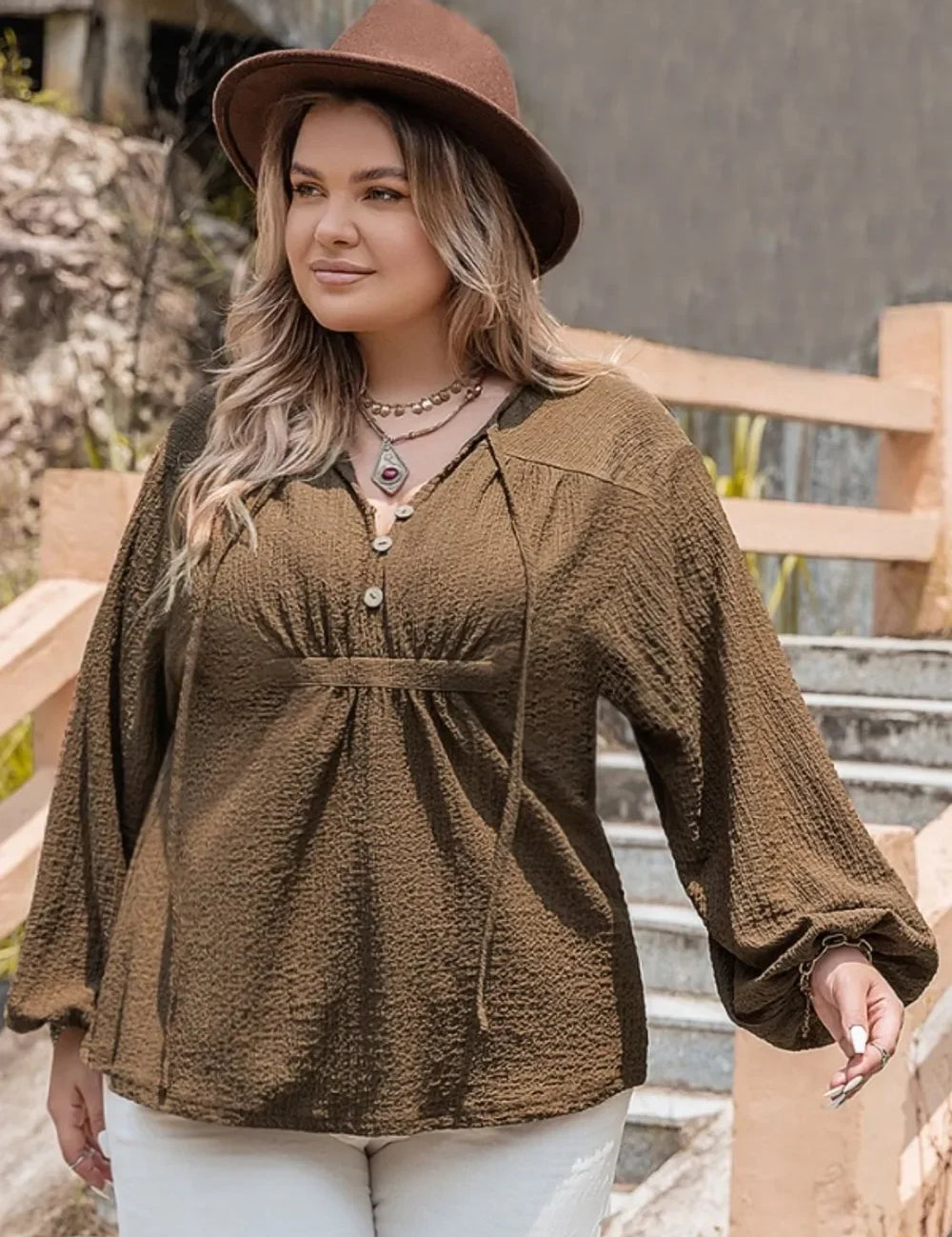 Plus size olive green textured blouse with tie neck and bell sleeves