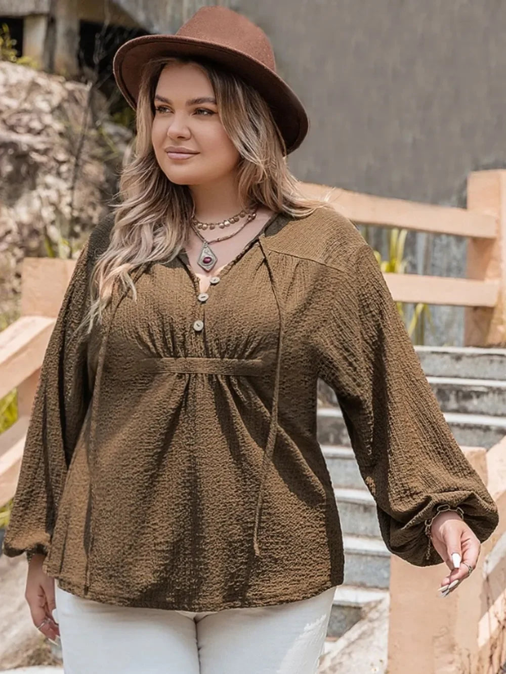 Plus size olive green textured blouse with tie neck and bell sleeves
