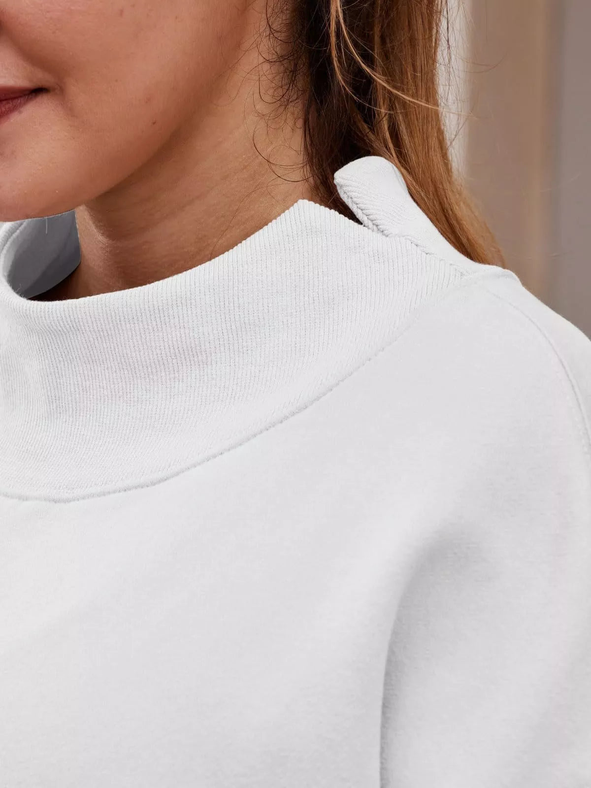White mock neck dropped shoulder sweatshirt with ribbed collar