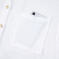 Womens lace sleeve button down cotton shirt with white textured fabric and front pocket holding silver smartphone