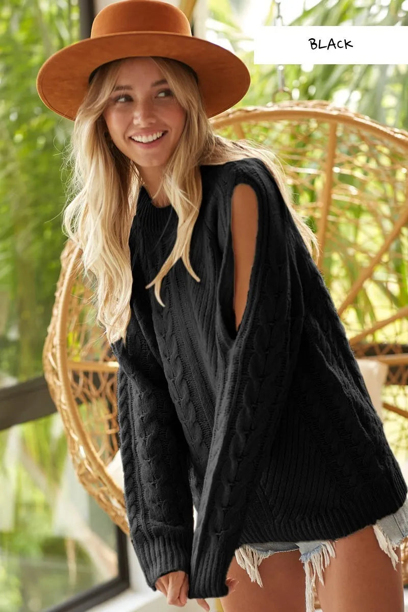 Black cable-knit BiBi Twist sweater with open shoulder cutouts