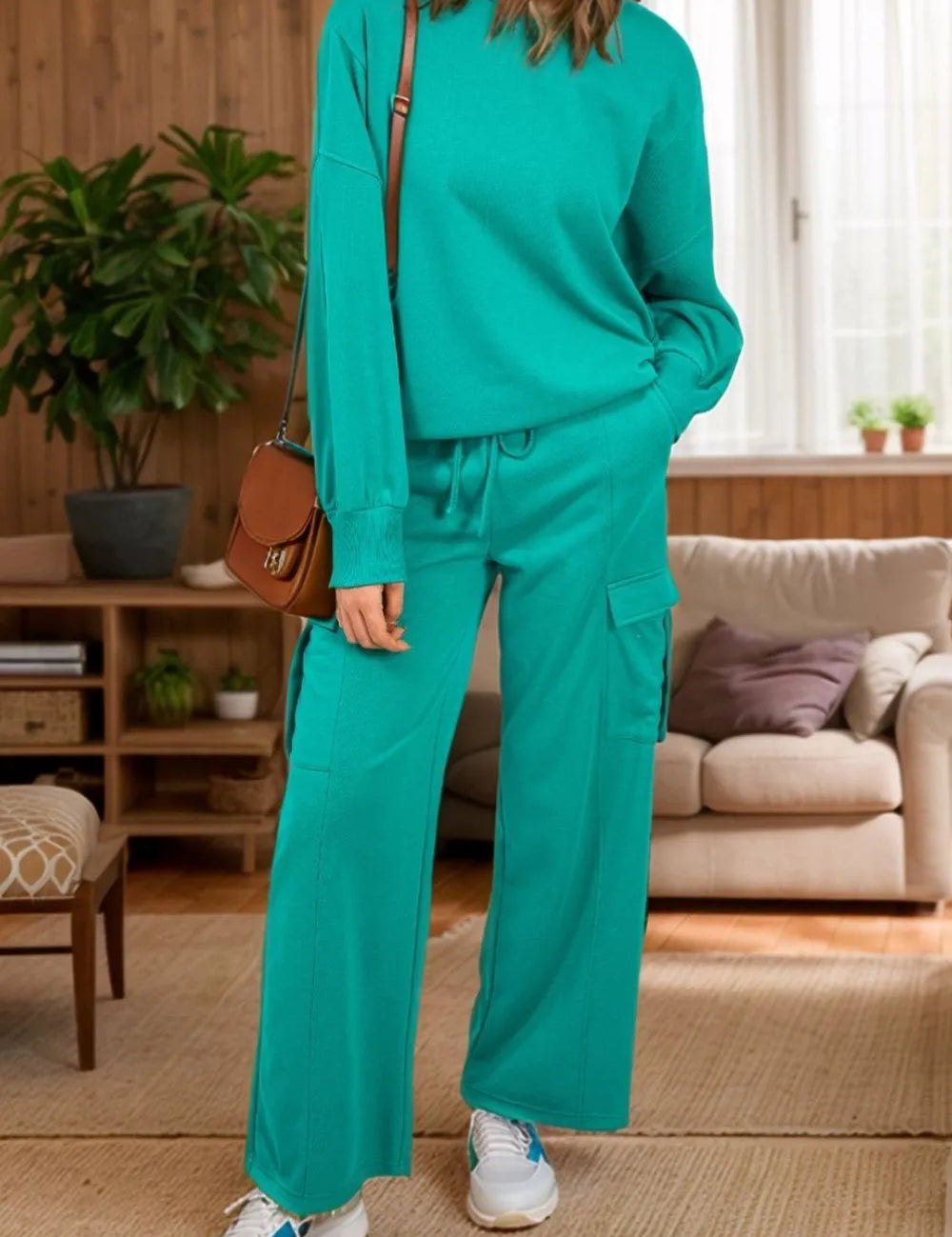 Teal green cashmere round neck long sleeve top and drawstring pants set with white sneakers