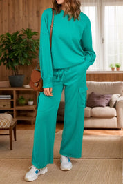 Teal green cashmere round neck long sleeve top and drawstring pants set with white sneakers