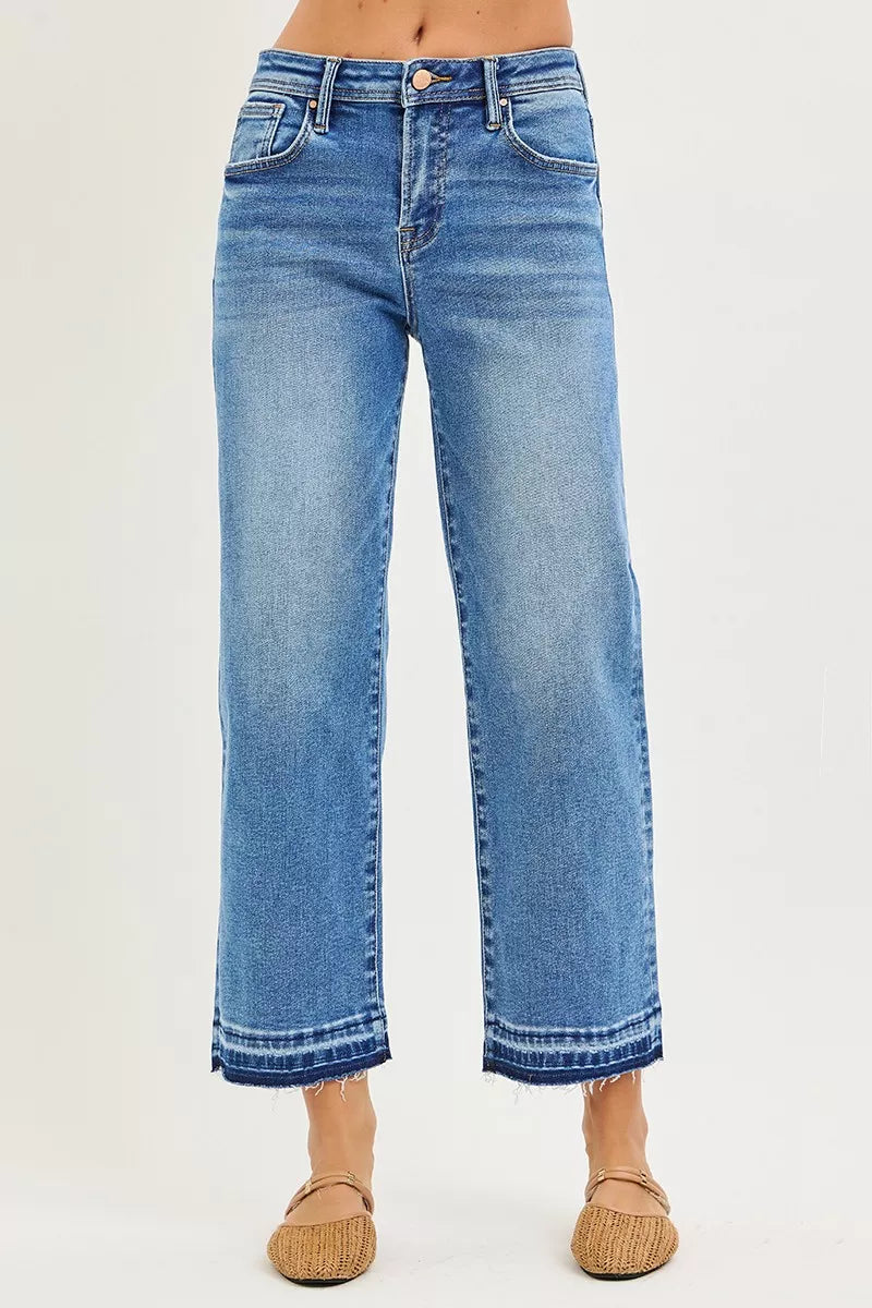Mid-wash blue RISEN boyfriend jeans, straight-leg cropped with frayed hem