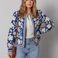 Blue and white floral bomber jacket with open front and buttoned cuffs