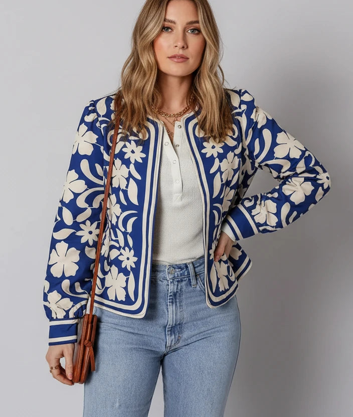 Blue and white floral bomber jacket with open front and buttoned cuffs
