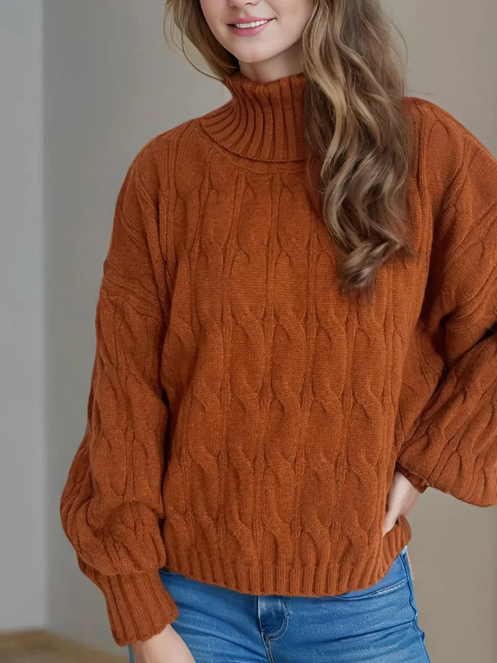 Burnt orange cable-knit turtleneck sweater with balloon sleeves