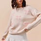 SO ME cream knit sweater with pink embroidered bows