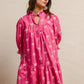 Vibrant pink BiBi ribbon pattern dress with white bows, puffed sleeves, scalloped edges
