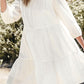 3/4 sleeve tiered mini dress with flowing white tiers and lace neckline