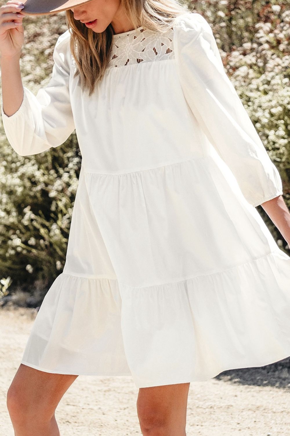 3/4 sleeve tiered mini dress with flowing white tiers and lace neckline