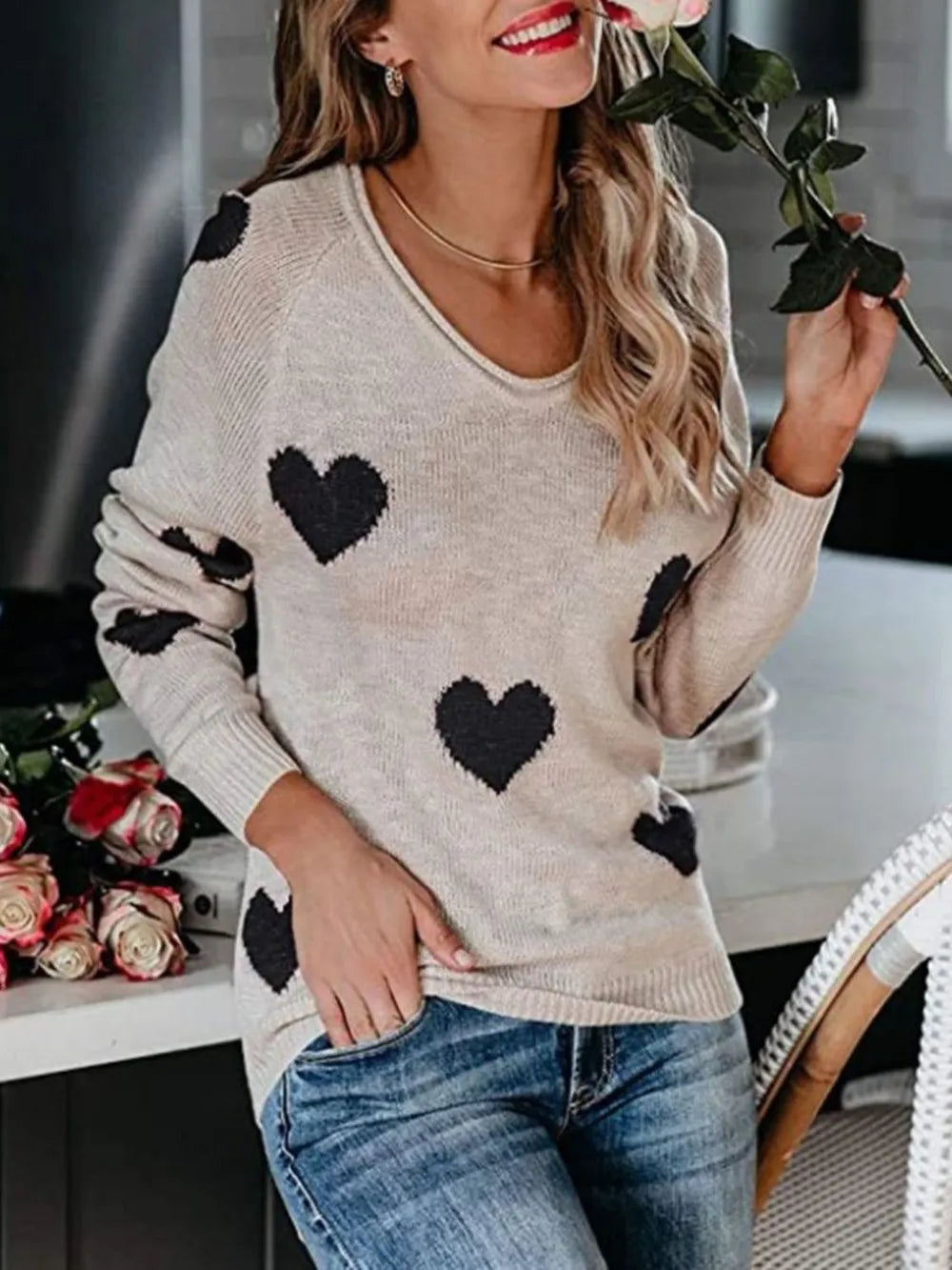 Soft beige knit Heart Scoop Neck sweater with black heart patterns