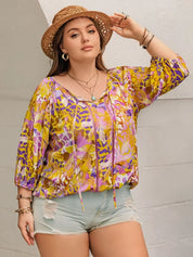 Plus size printed tie neck blouse in yellow purple florals with ruffles