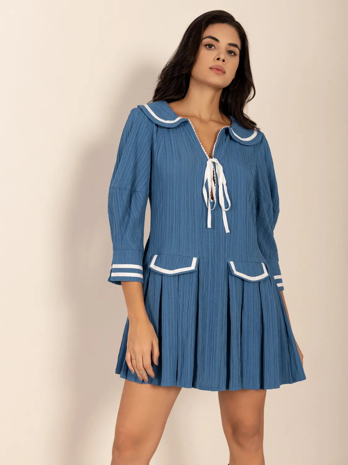 Blue pleated mini dress with Peter Pan collar and tie front