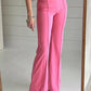 Bright pink high-waisted bootcut pants with flared tailored fit