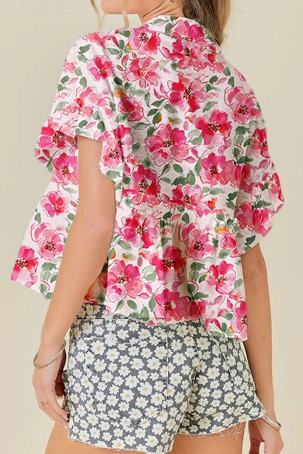 Pink floral boxy fit ruffled short sleeve blouse with peplum hem