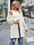 Cream-colored oversized waffle-knit cardigan with open shoulders