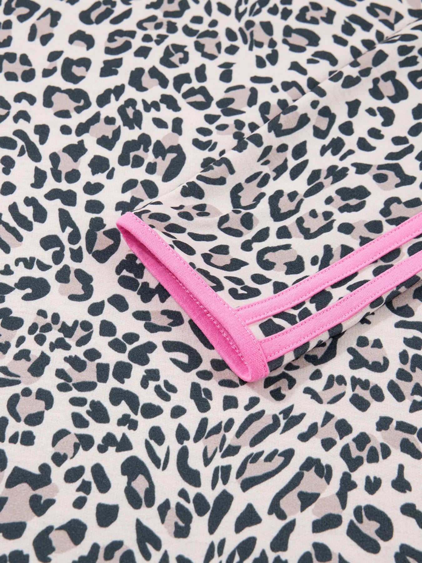 Women’s leopard print V-neck long sleeve top with pink trim