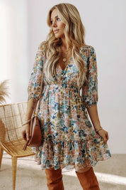 Floral printed V-neck half sleeve mini dress with ruffled hem and brown leather handbag