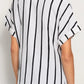 Black and white striped short-sleeve button-up shirt with rolled cuffs