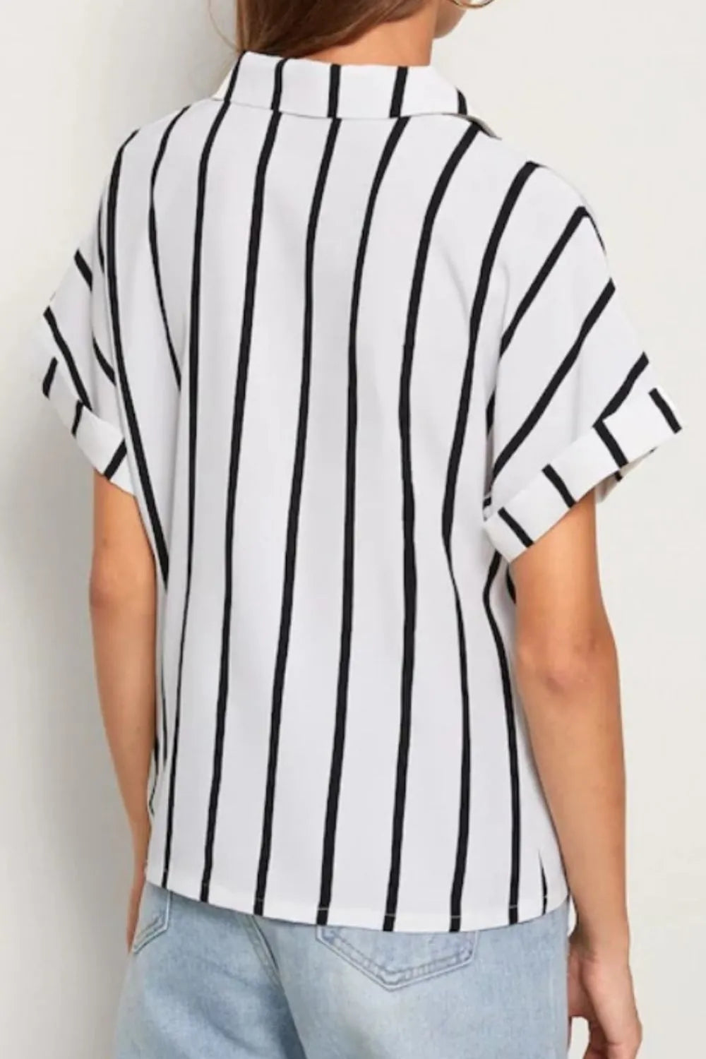 Black and white striped short-sleeve button-up shirt with rolled cuffs