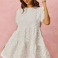White textured SO ME floral jacquard diagonal tiered short mini dress with puffed sleeves and gathered waist